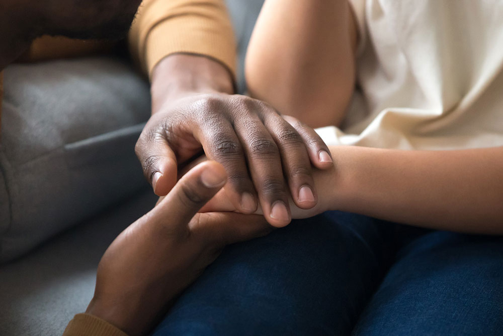 close up of women holding hands
