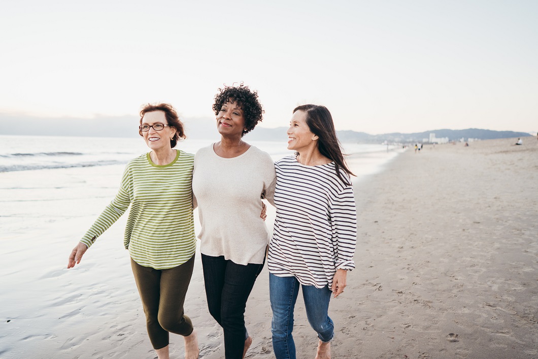 Three ladies walking on the beach