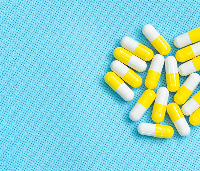 bright blue background with bright pills